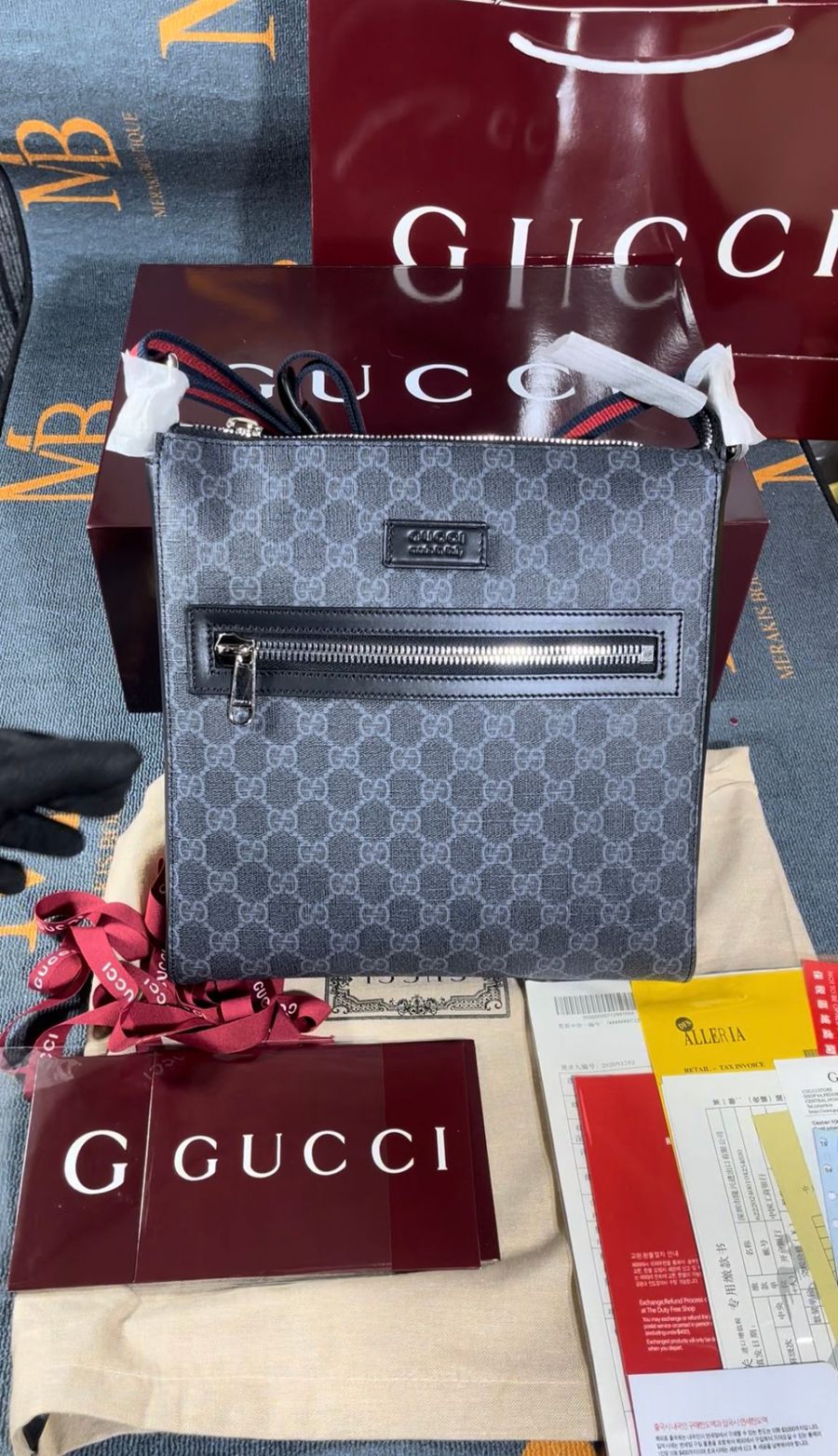 GG Supreme messenger bag in black and grey with its box